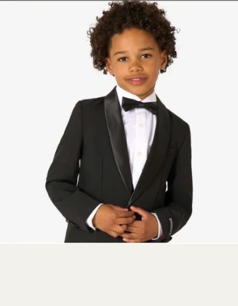 Young gentleman in a tailored black tuxedo